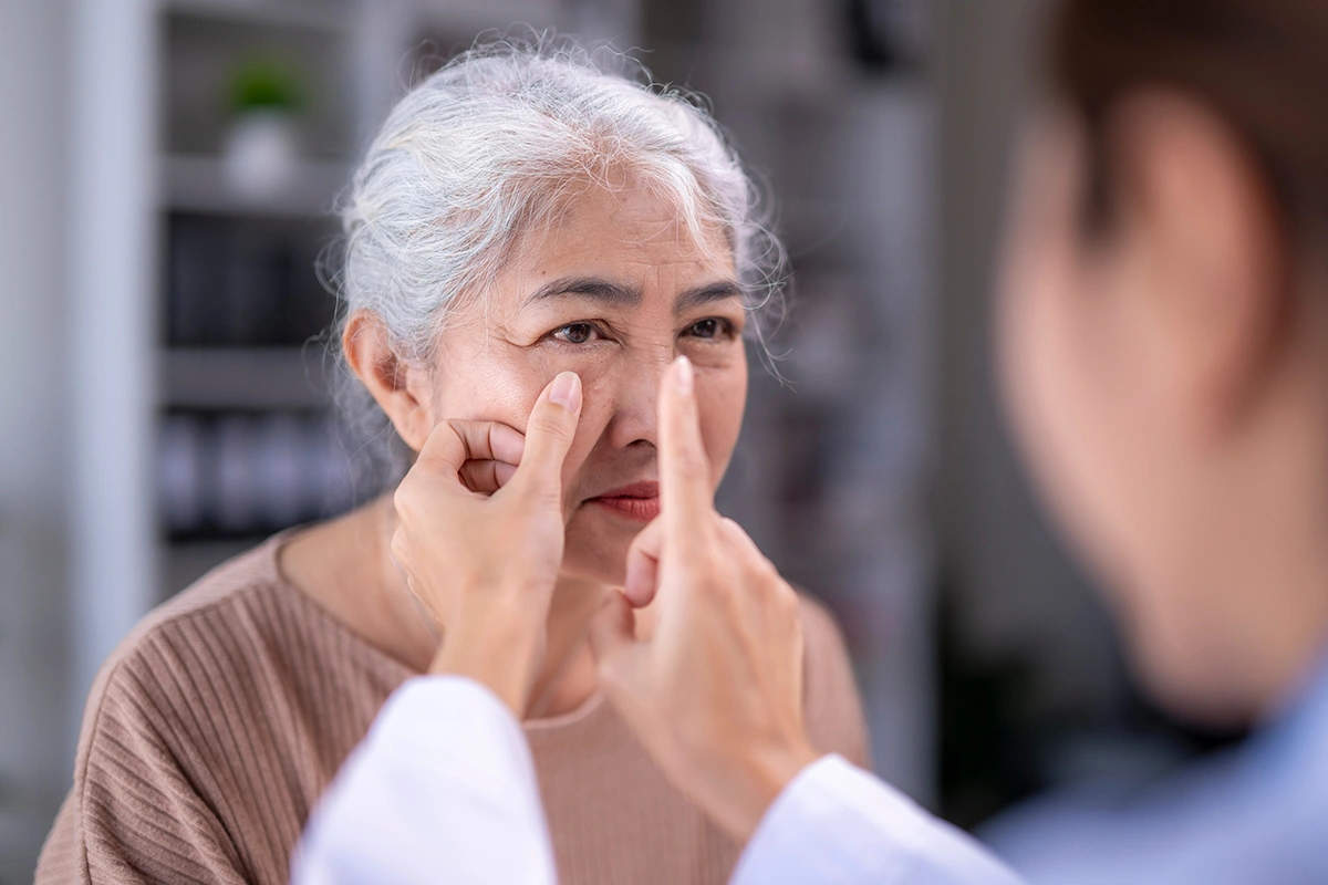 A patient undergoing an eye exam at an eye specialist clinic