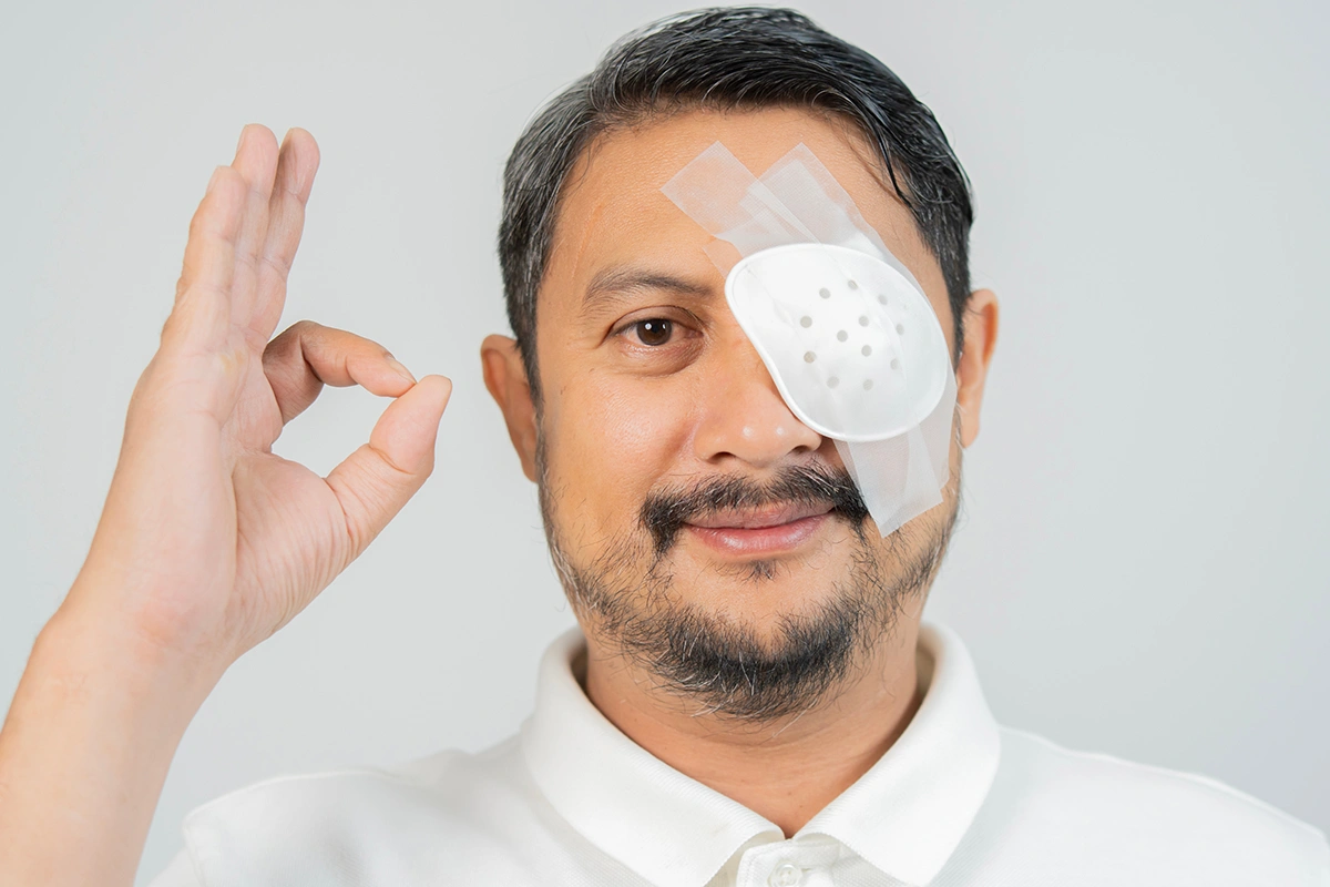 A man recovering from eye surgery