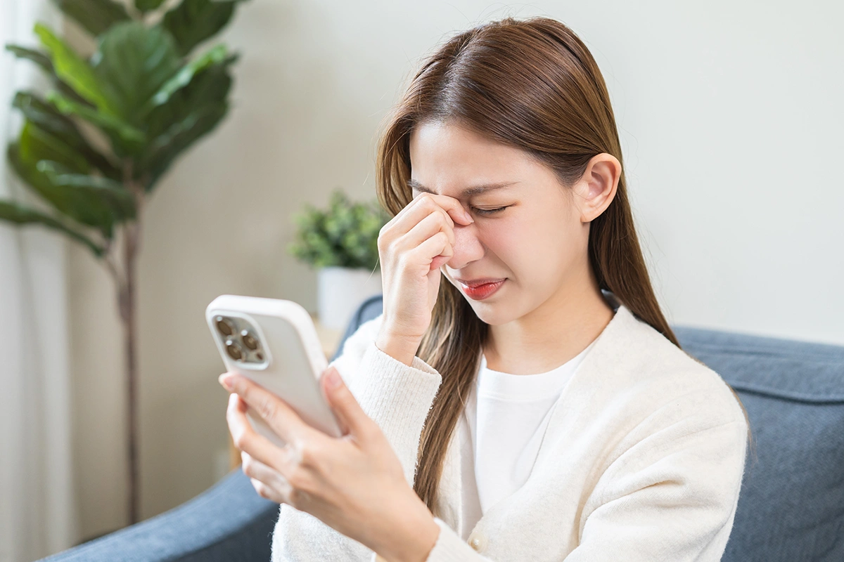 A woman experiencing eye discomfort